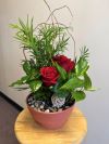 Planter with fresh red roses